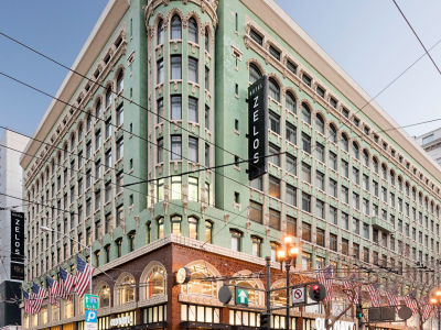 a group of people walking on a city street