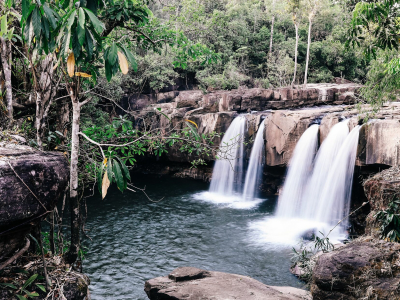 a large waterfall over some water