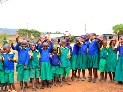 a group of people standing in front of a crowd posing for the camera