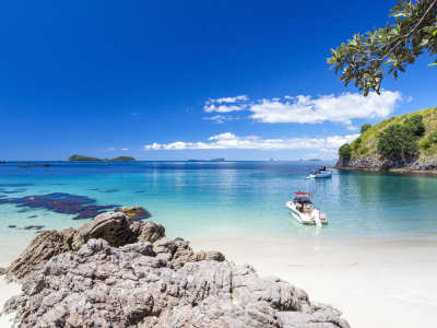 a rocky beach next to a body of water