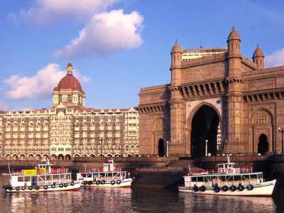 a boat on the water in front of a building