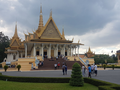 a statue in front of Royal Palace, Phnom Penh