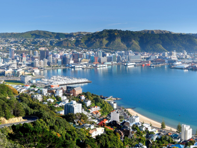 a large body of water with a city in the background