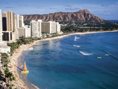 a large body of water with Diamond Head in the background