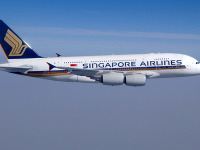 a large passenger jet flying through a blue sky