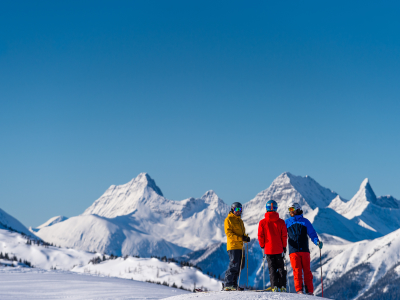 canada banff three skiers looking out on mountain.jpg