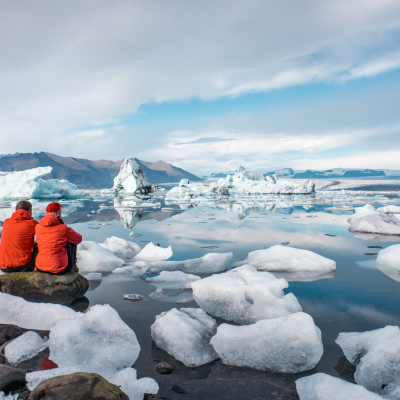 A young couple in glacier lagoon in Iceland.