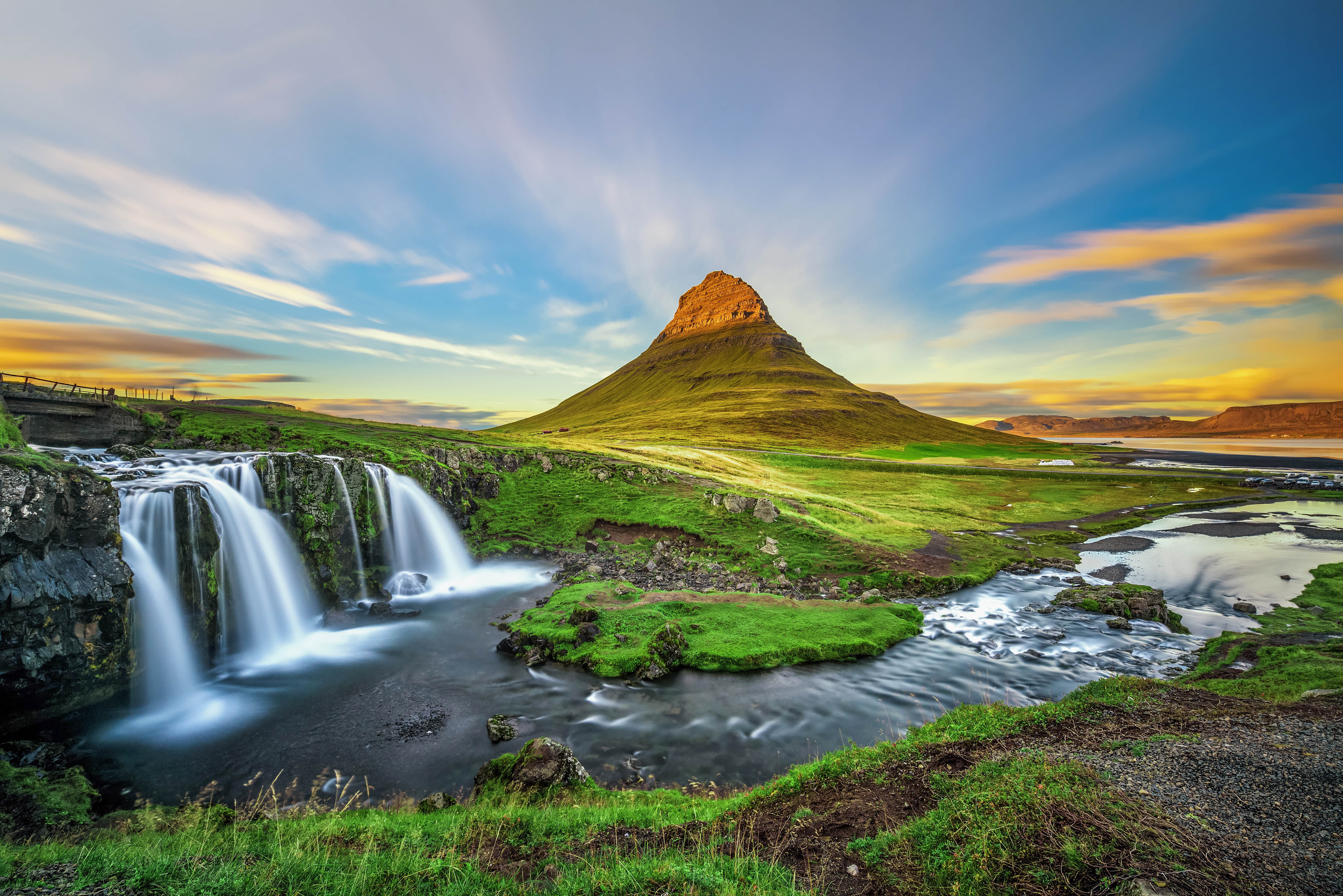 Sunset over Kirkjufellsfoss Waterfall and Kirkjufell mountain in