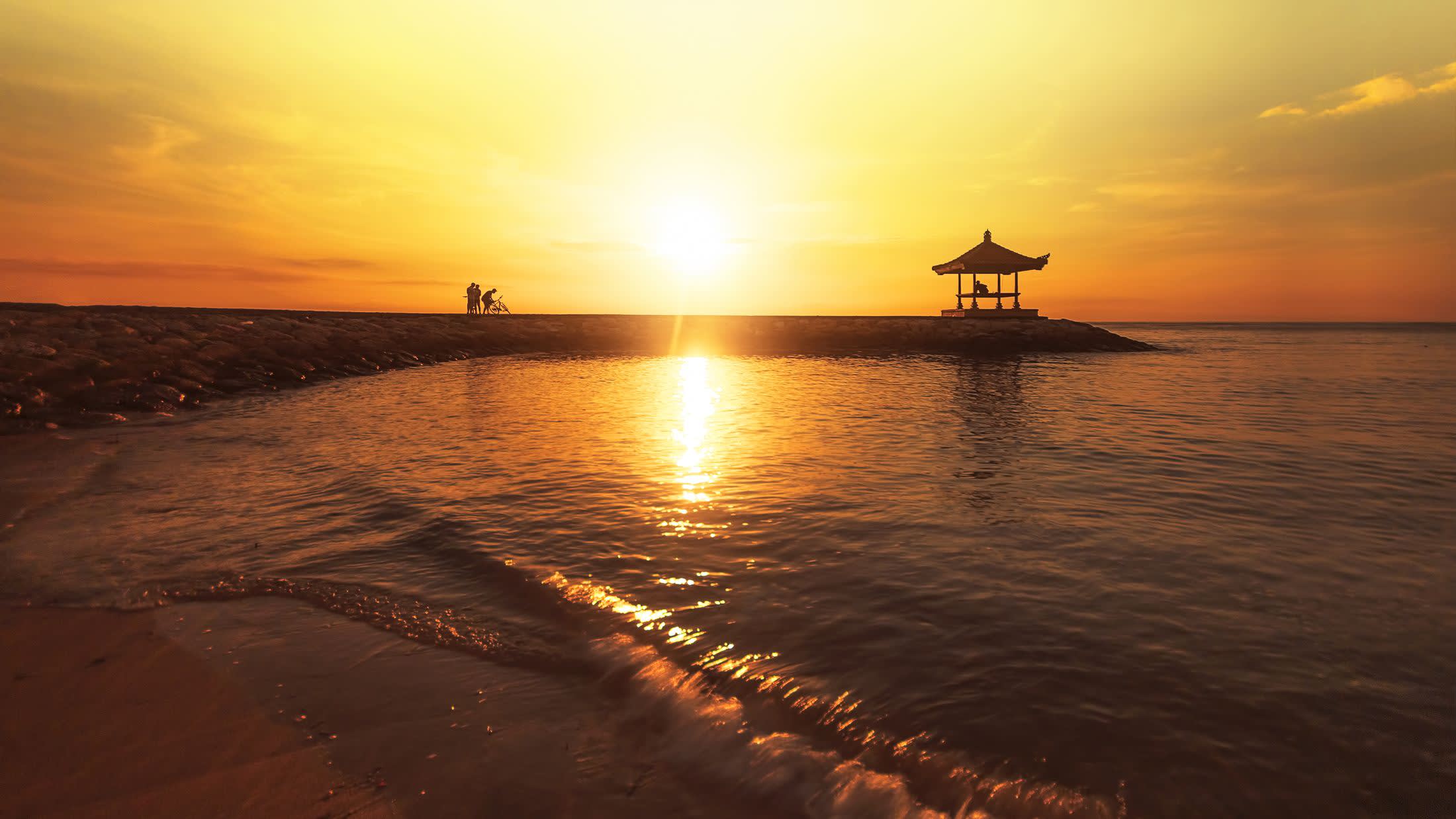 a sunset over a body of water