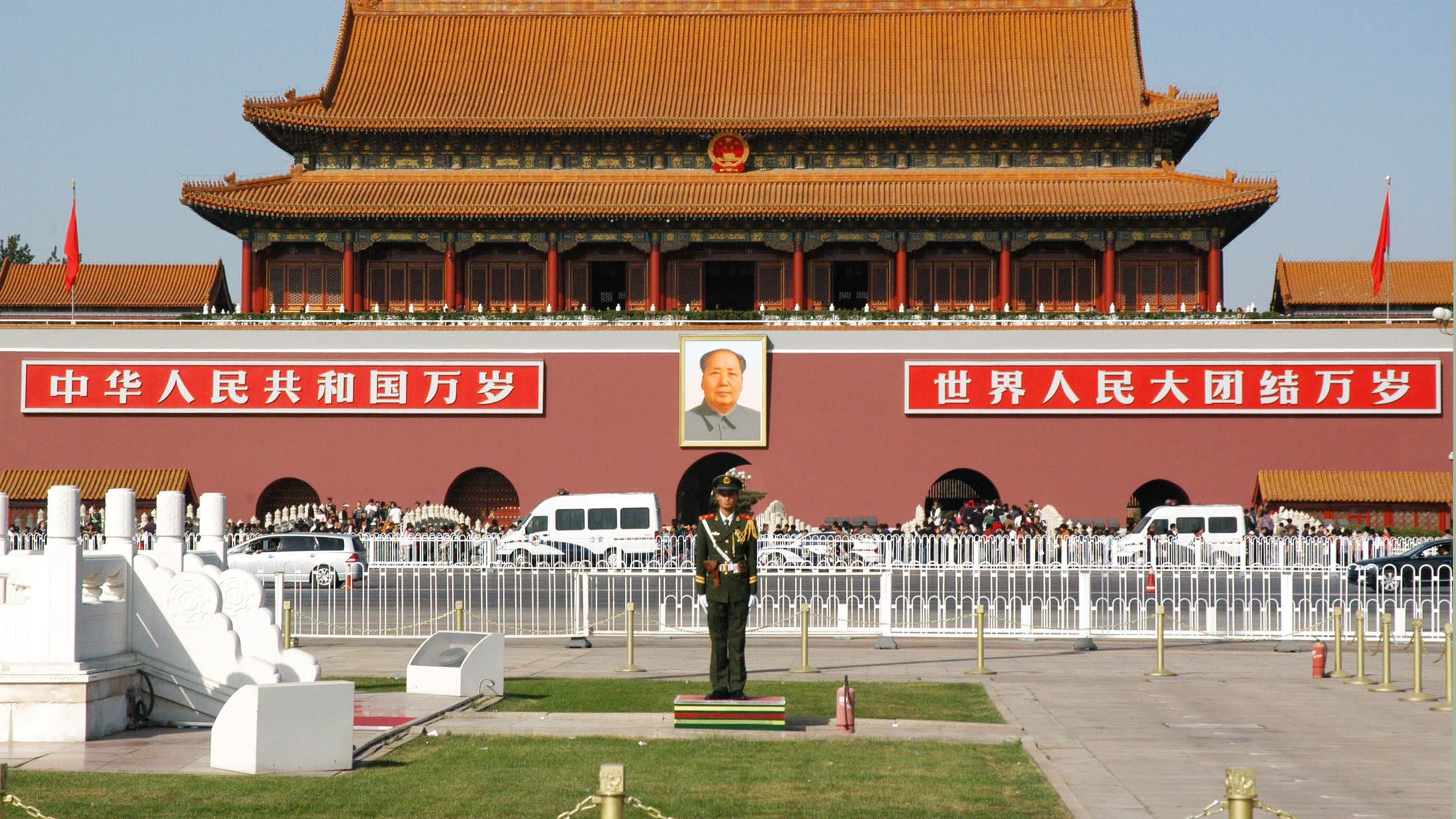 a group of people in front of Tiananmen Square