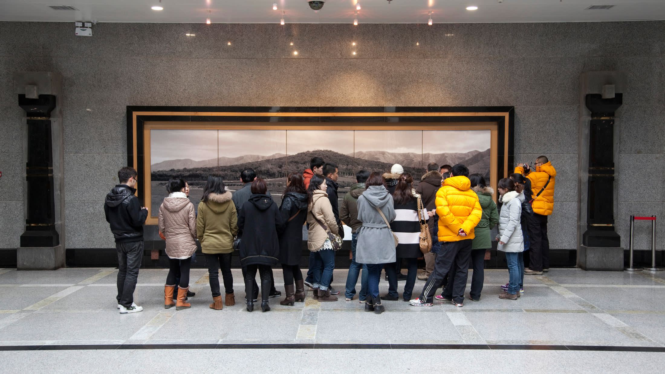 a group of people standing in front of a building
