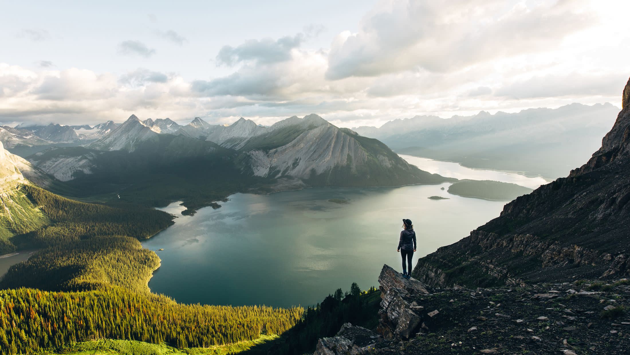 a group of people standing on the side of a mountain