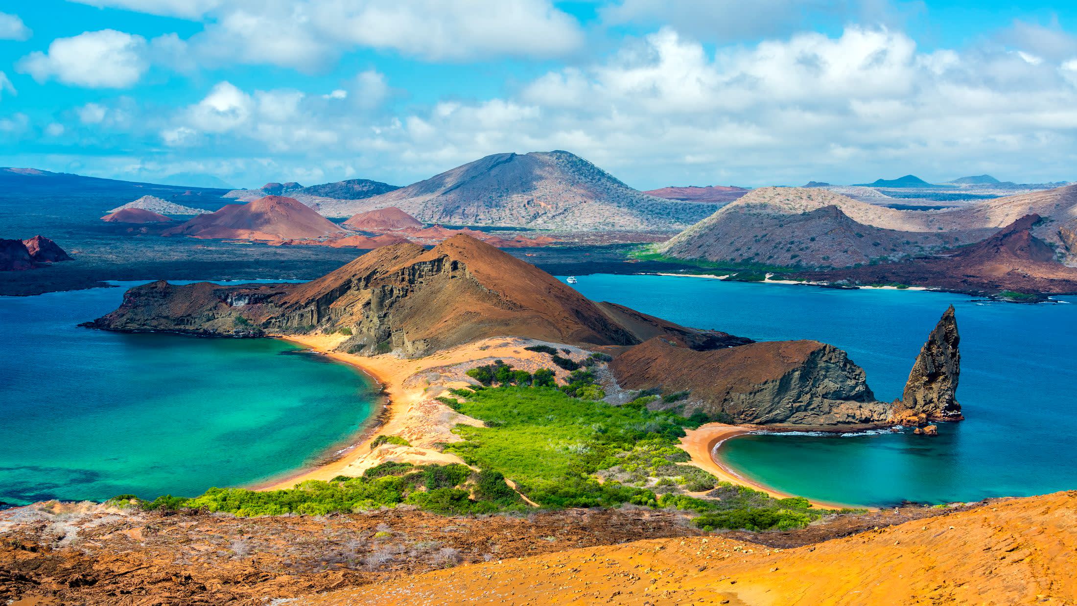 a body of water with a mountain in the background