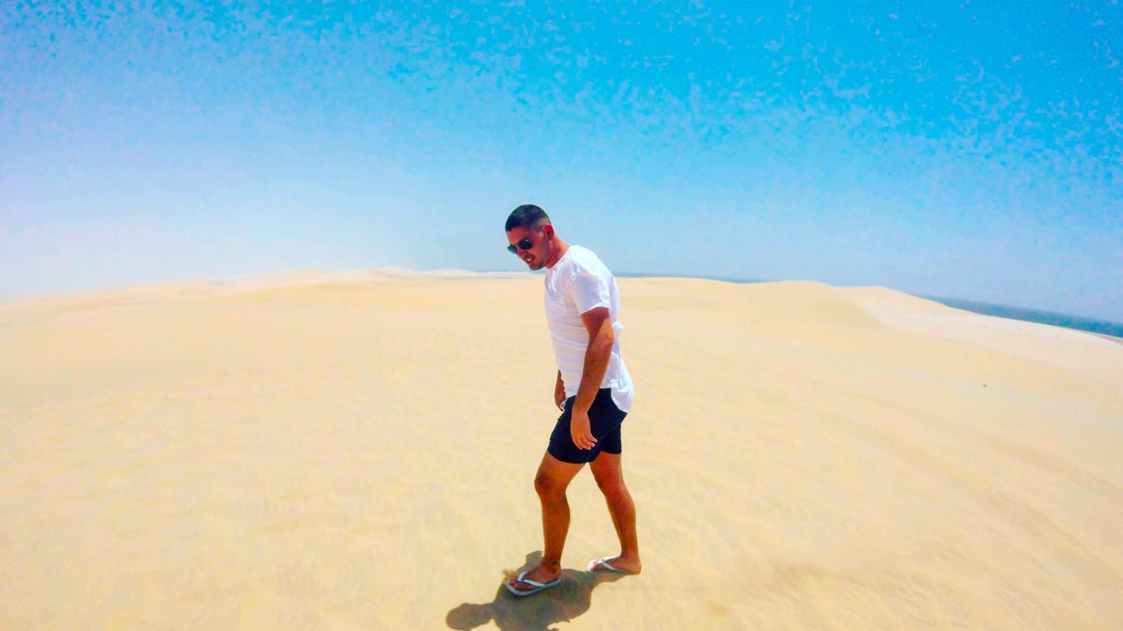 a man standing on a beach