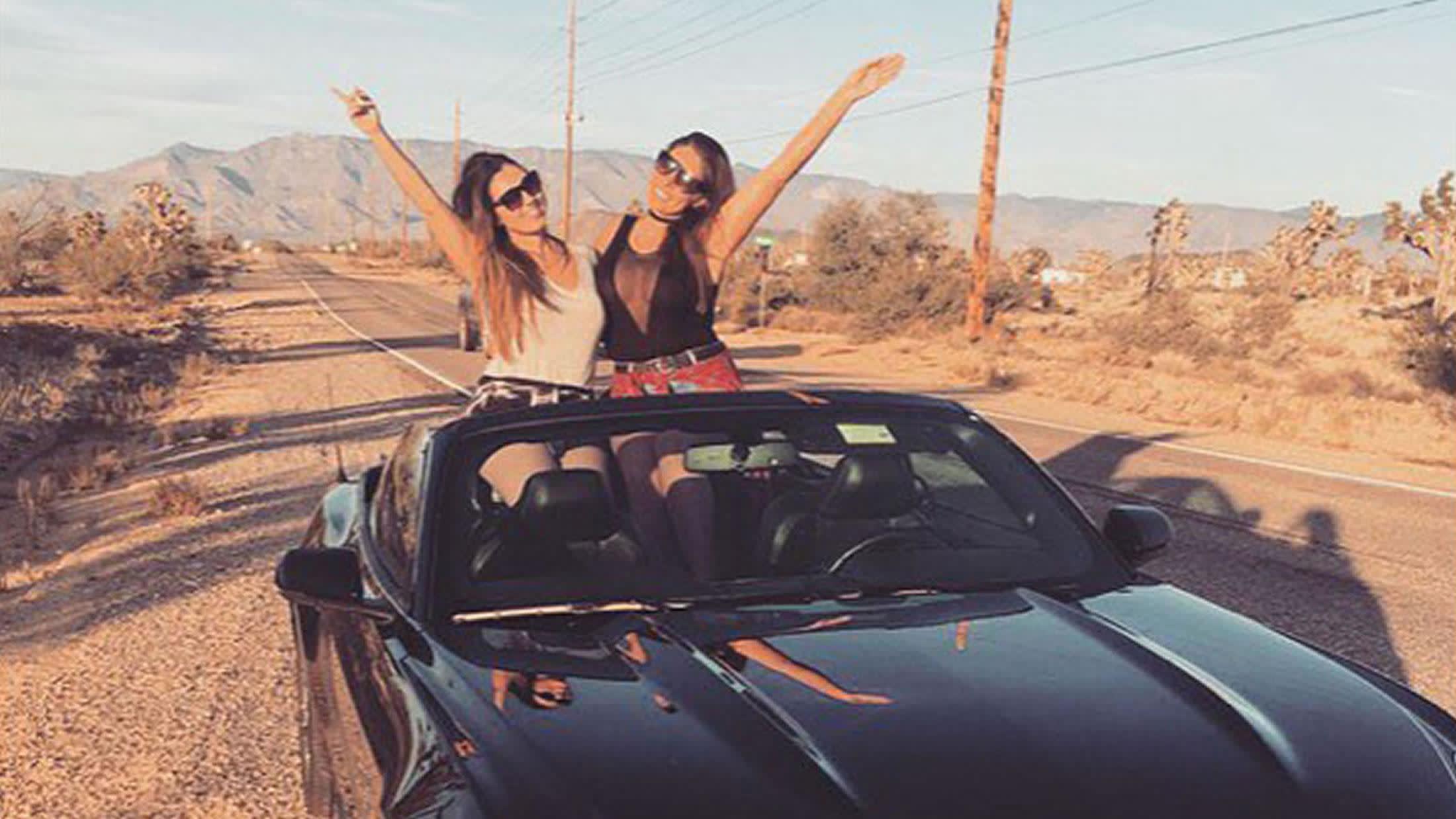 a person riding on the back of a car