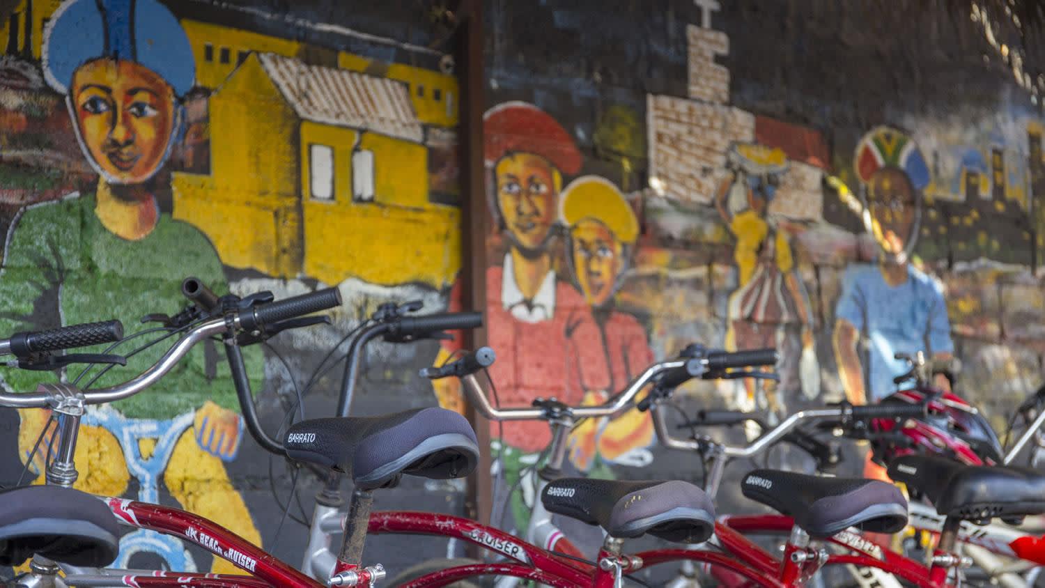 a motorcycle parked on the side of a building
