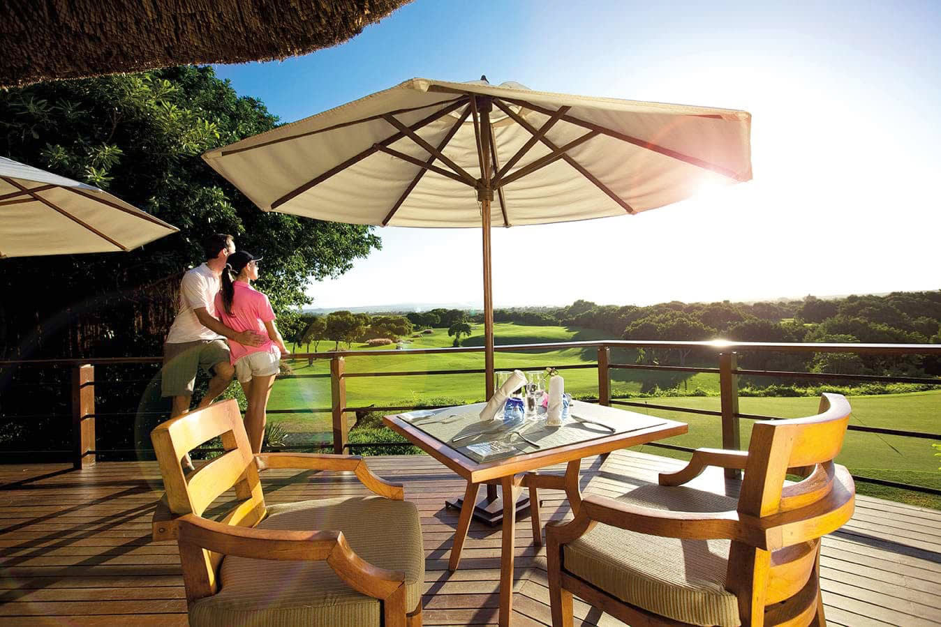 an umbrella sitting on top of a wooden table