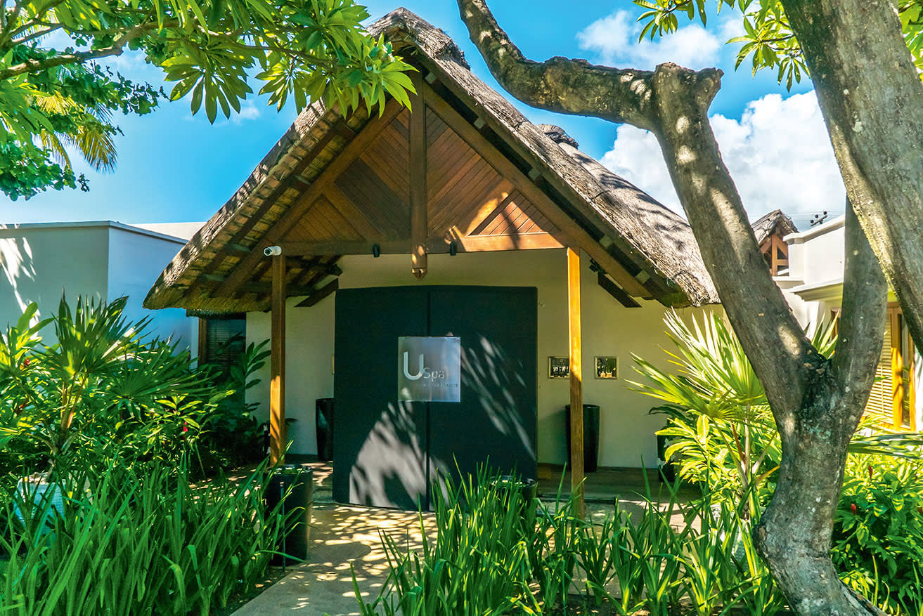 a tree in front of a house