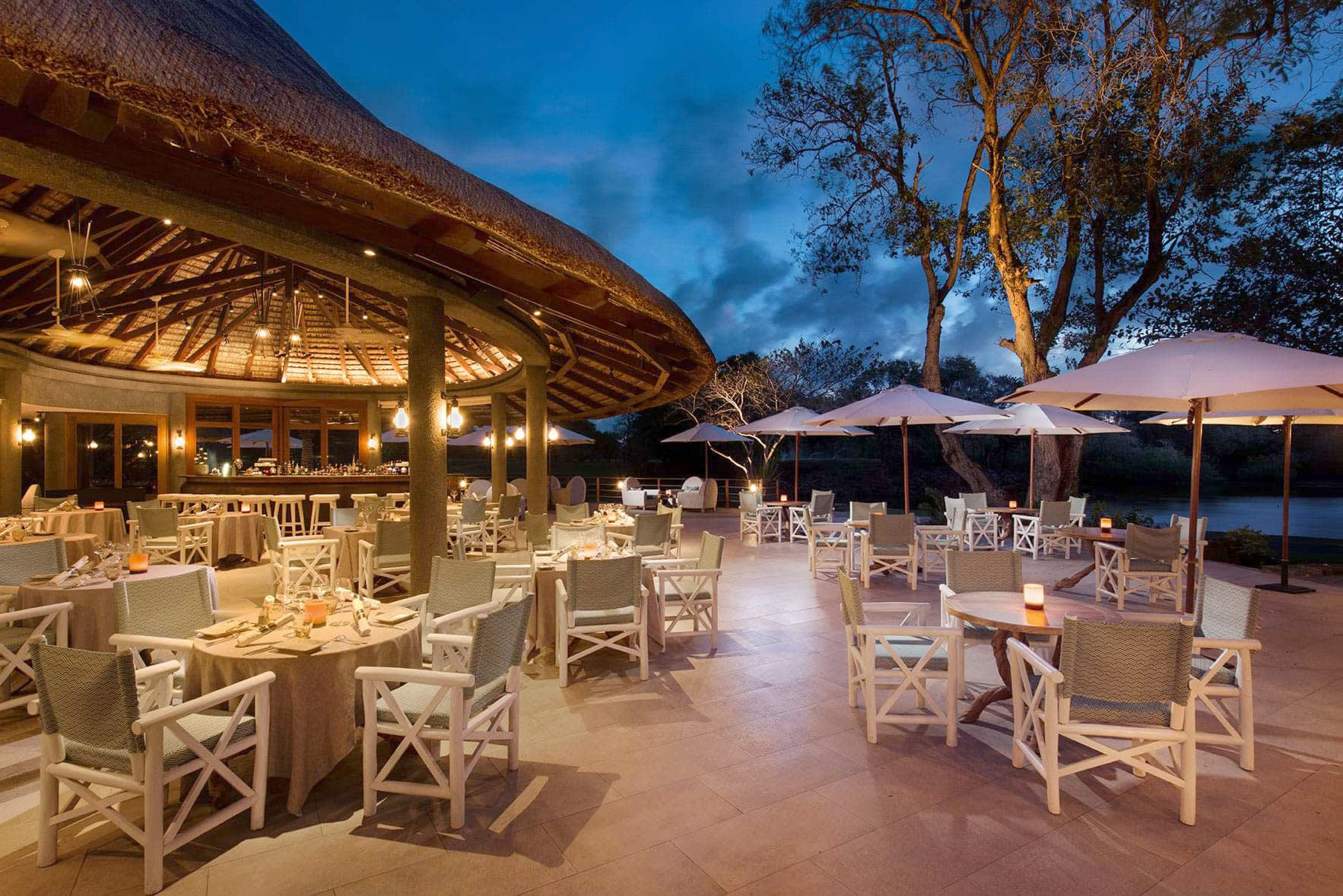 a group of lawn chairs sitting on top of a picnic table