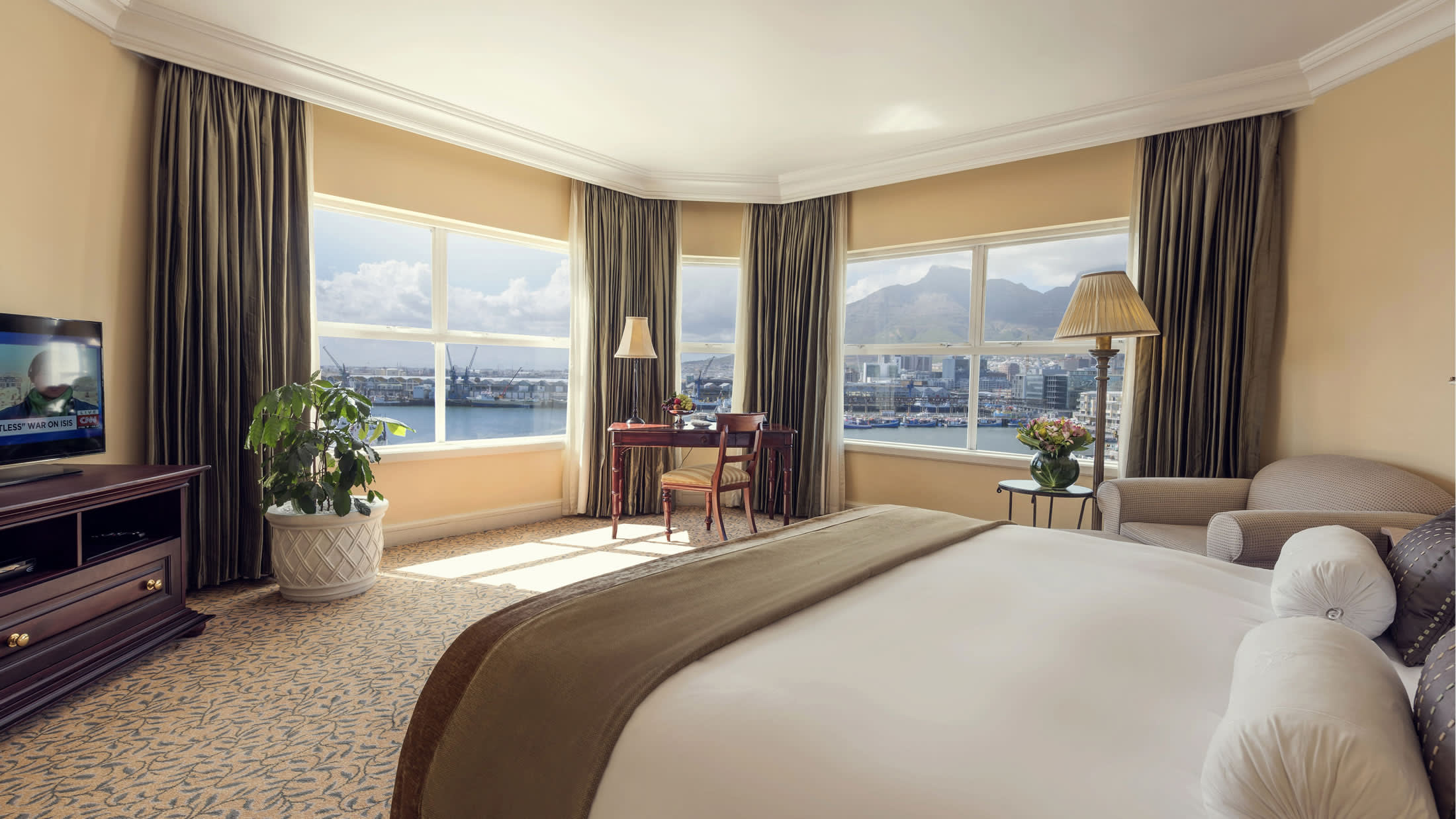 a view of a living room filled with furniture and a large window