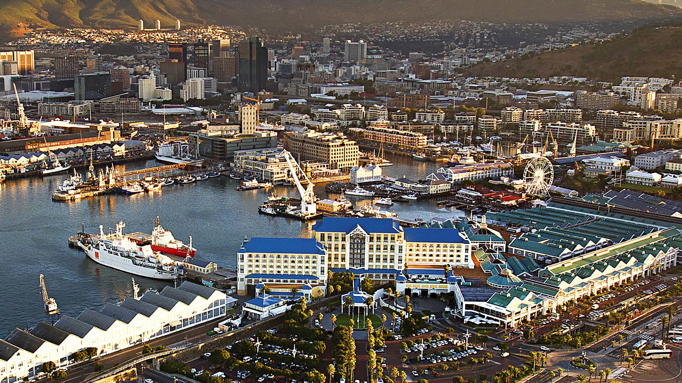 a large body of water with a city in the background