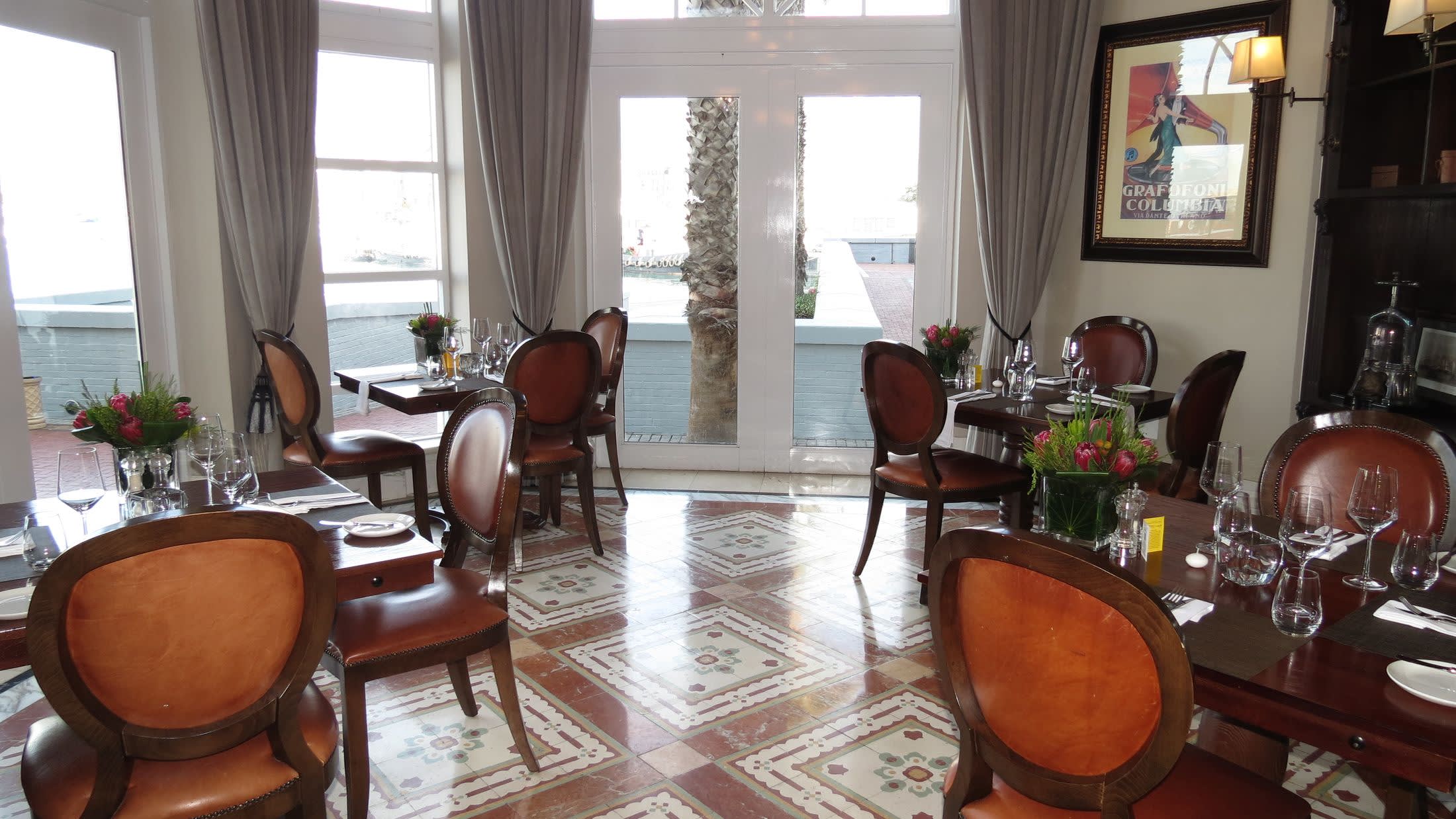 a living room filled with furniture and a large window