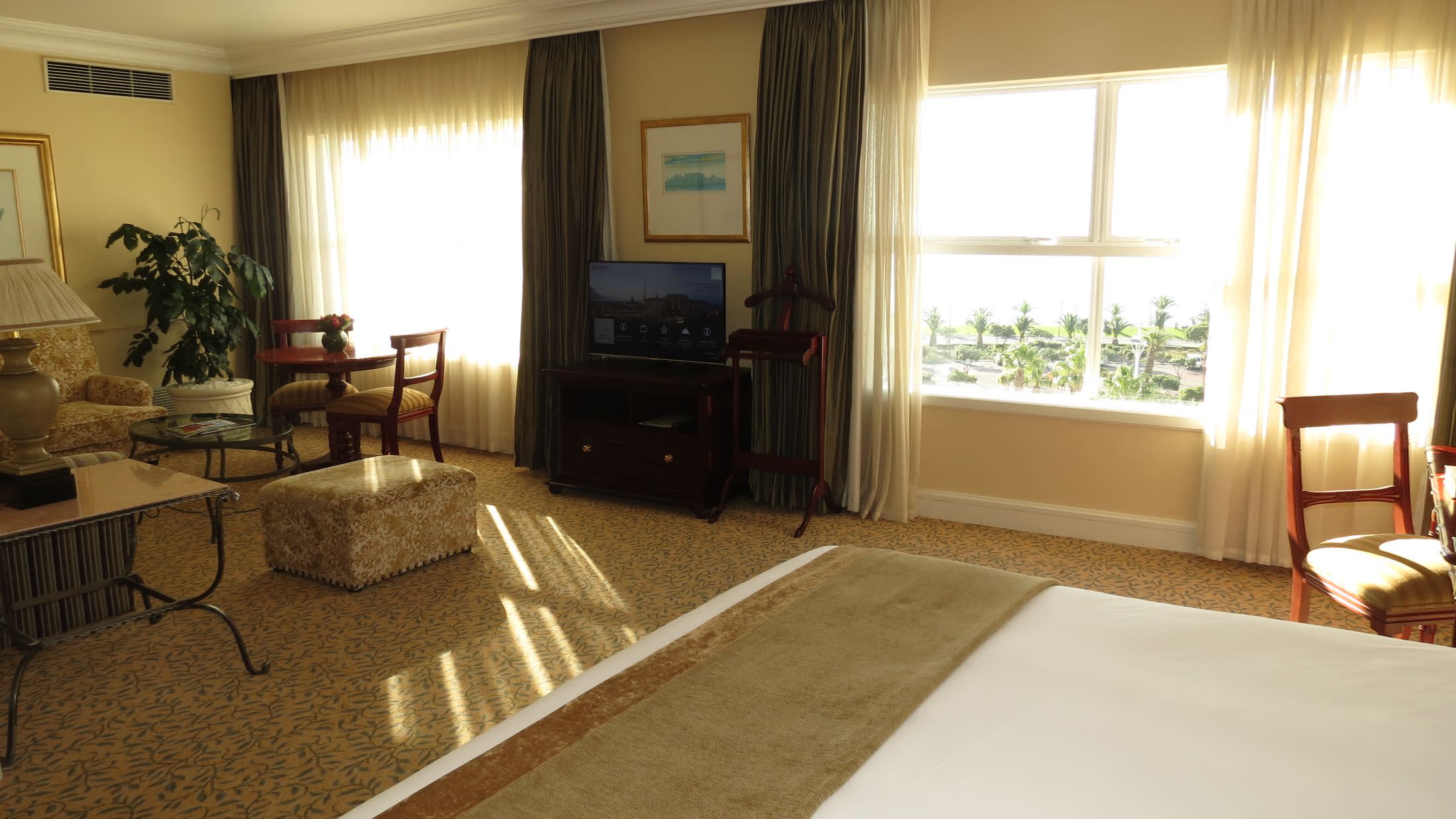 a living room filled with furniture and a large window