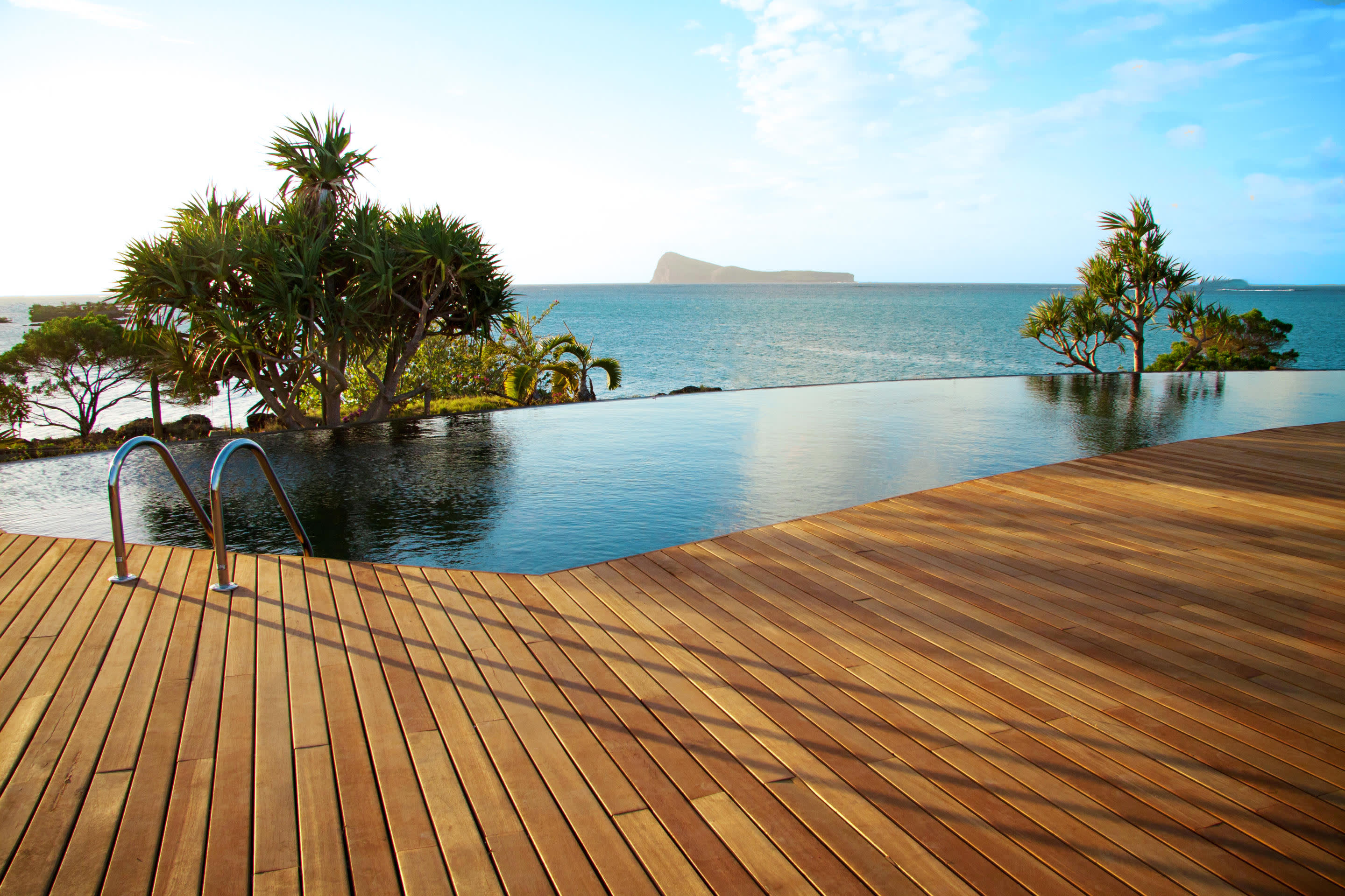a wooden bench overlooking a body of water