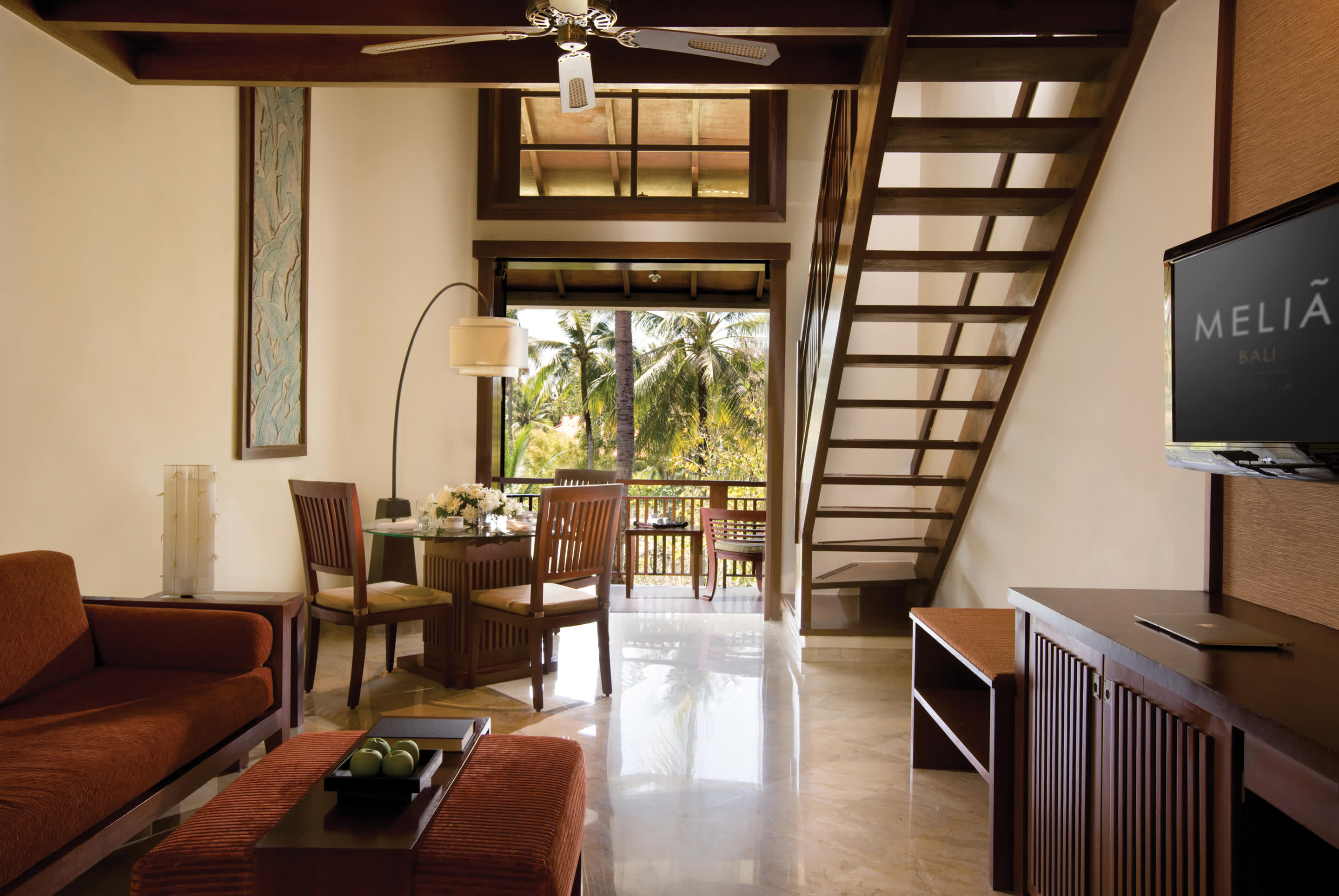 a living room filled with furniture and a large window