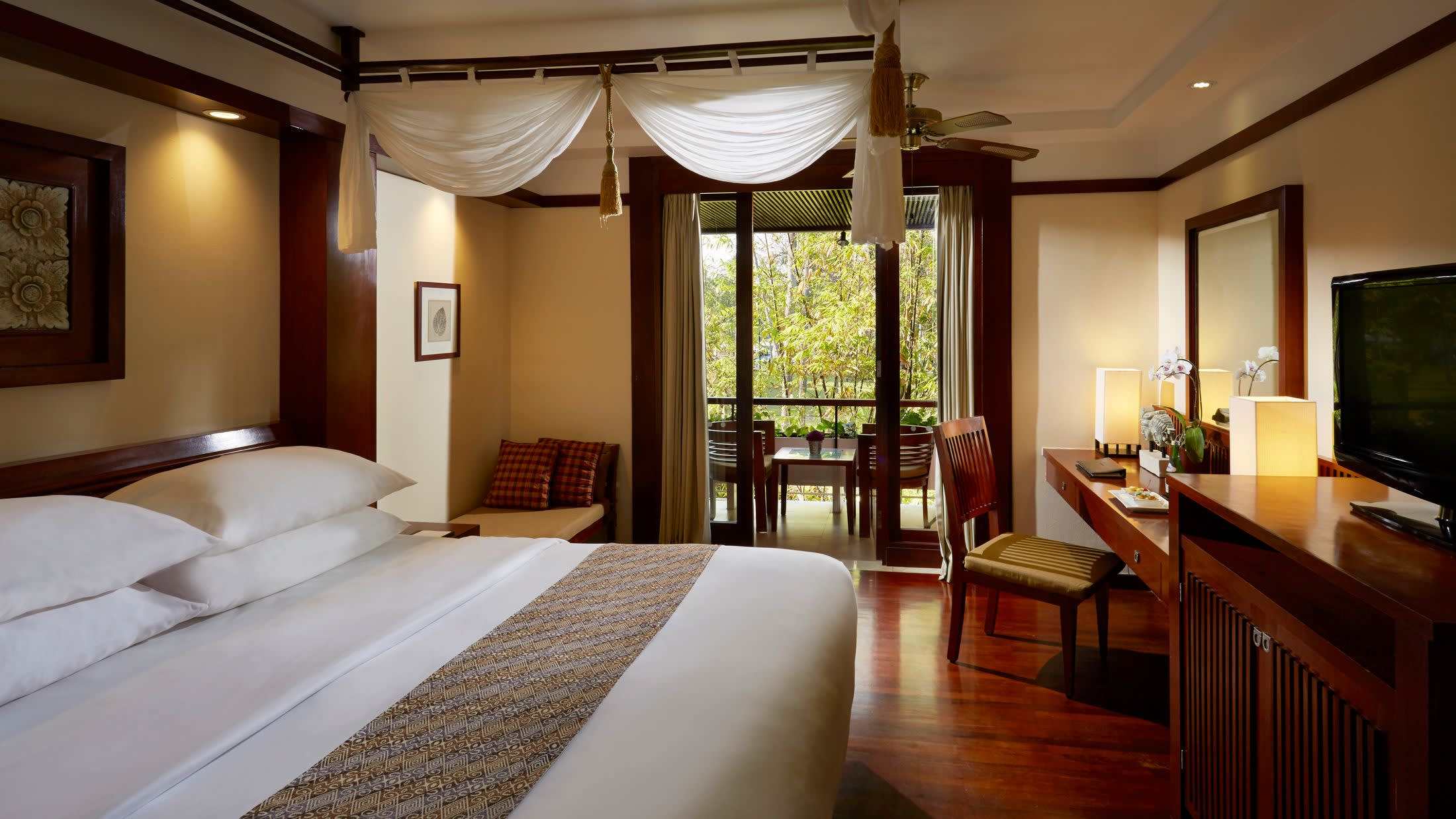 a bedroom with a large bed in a hotel room