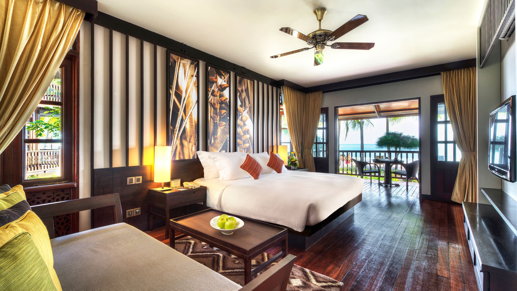 a living room filled with furniture and a large window