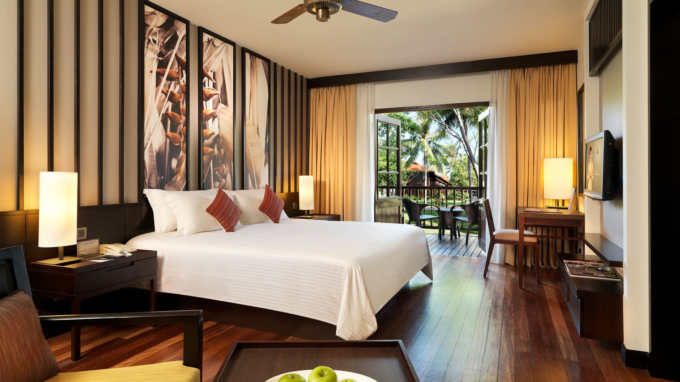 a living room filled with furniture and a large window