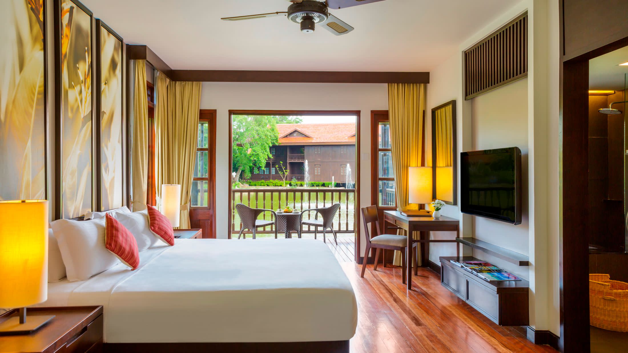 a living room filled with furniture and a large window