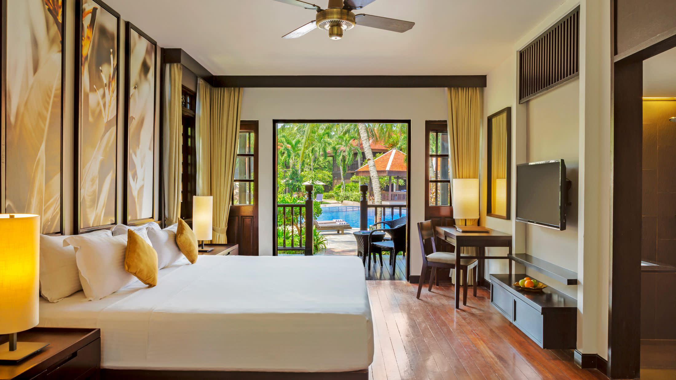 a living room filled with furniture and a large window