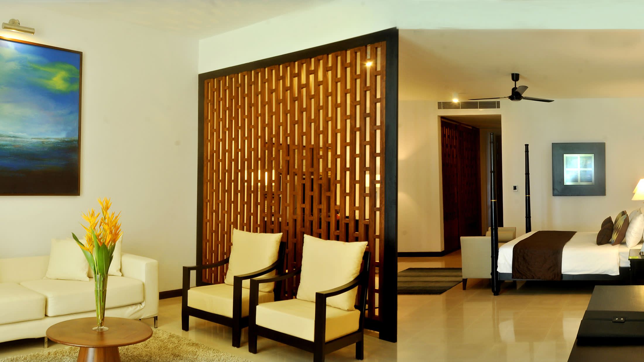 a living room filled with furniture and a flat screen tv