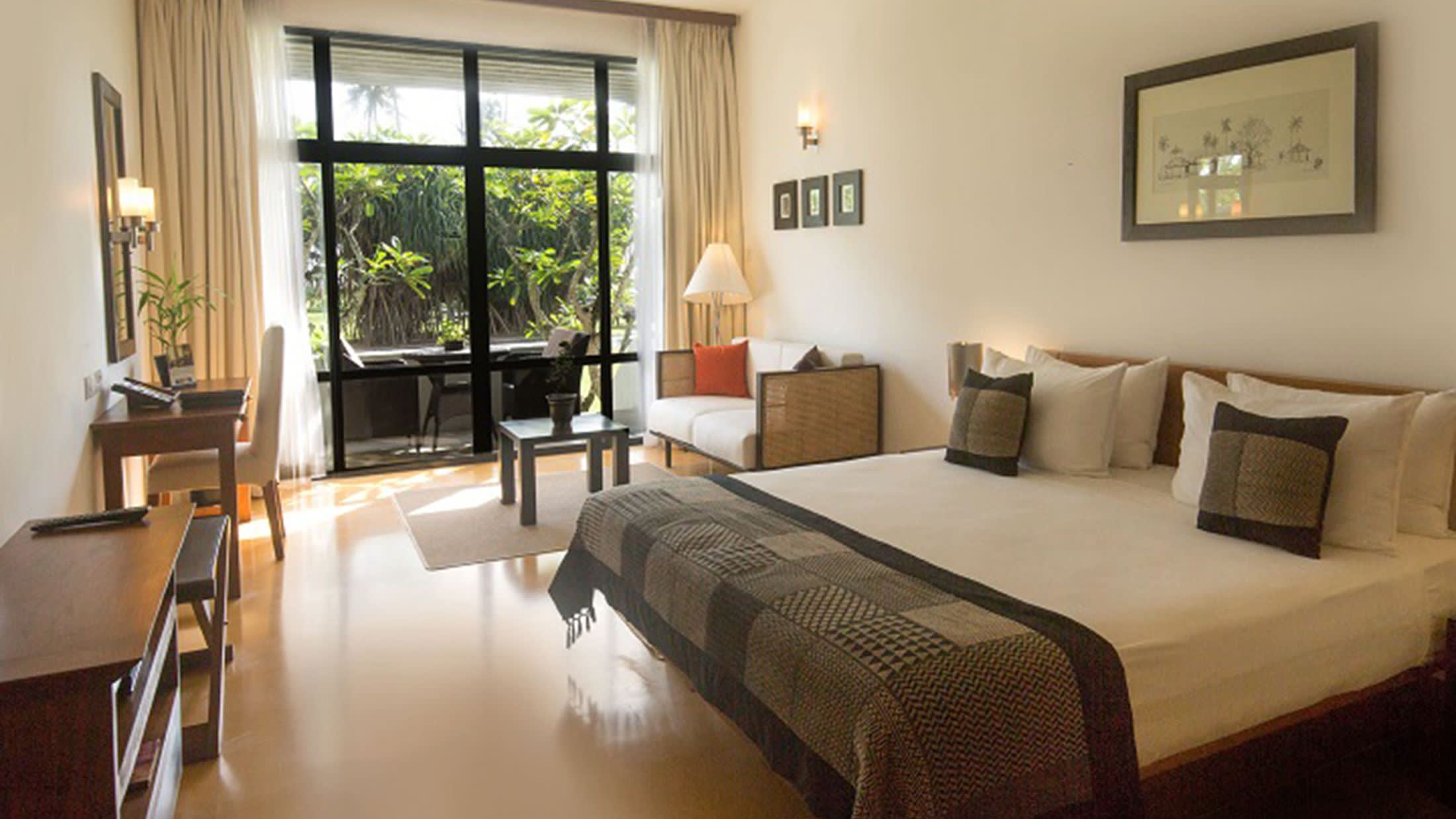 a bedroom with a large bed in a hotel room