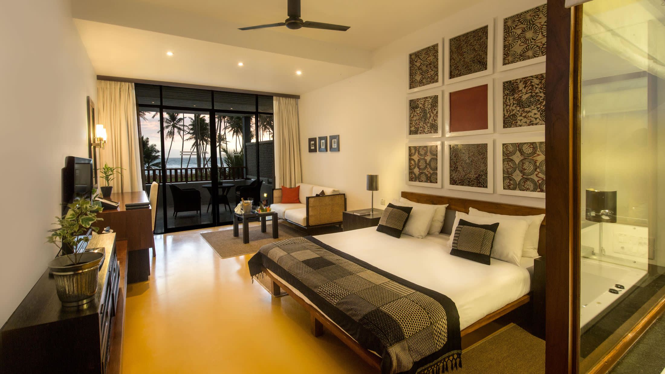 a view of a living room with a bed and a window