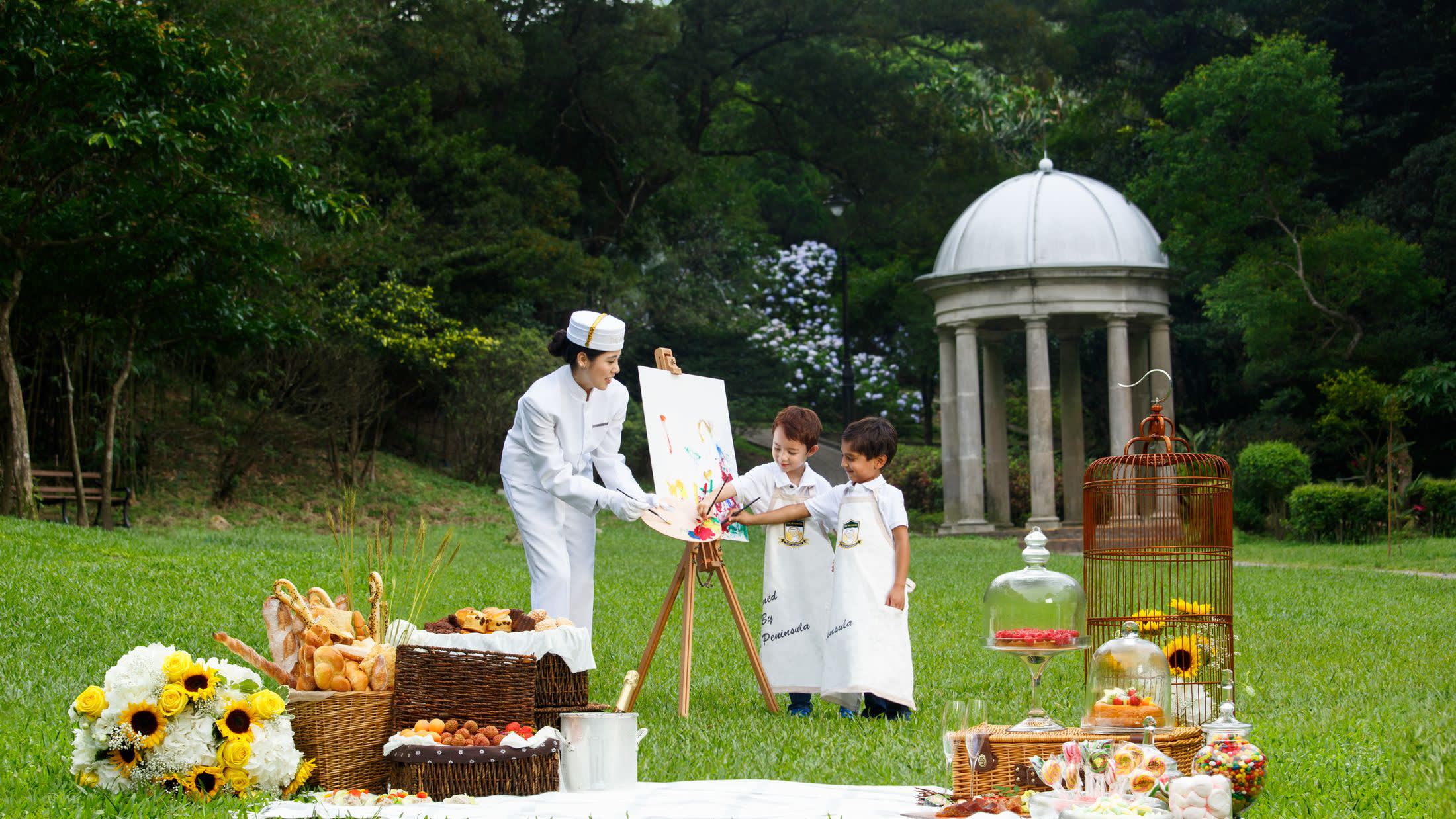 a group of people sitting at a picnic table