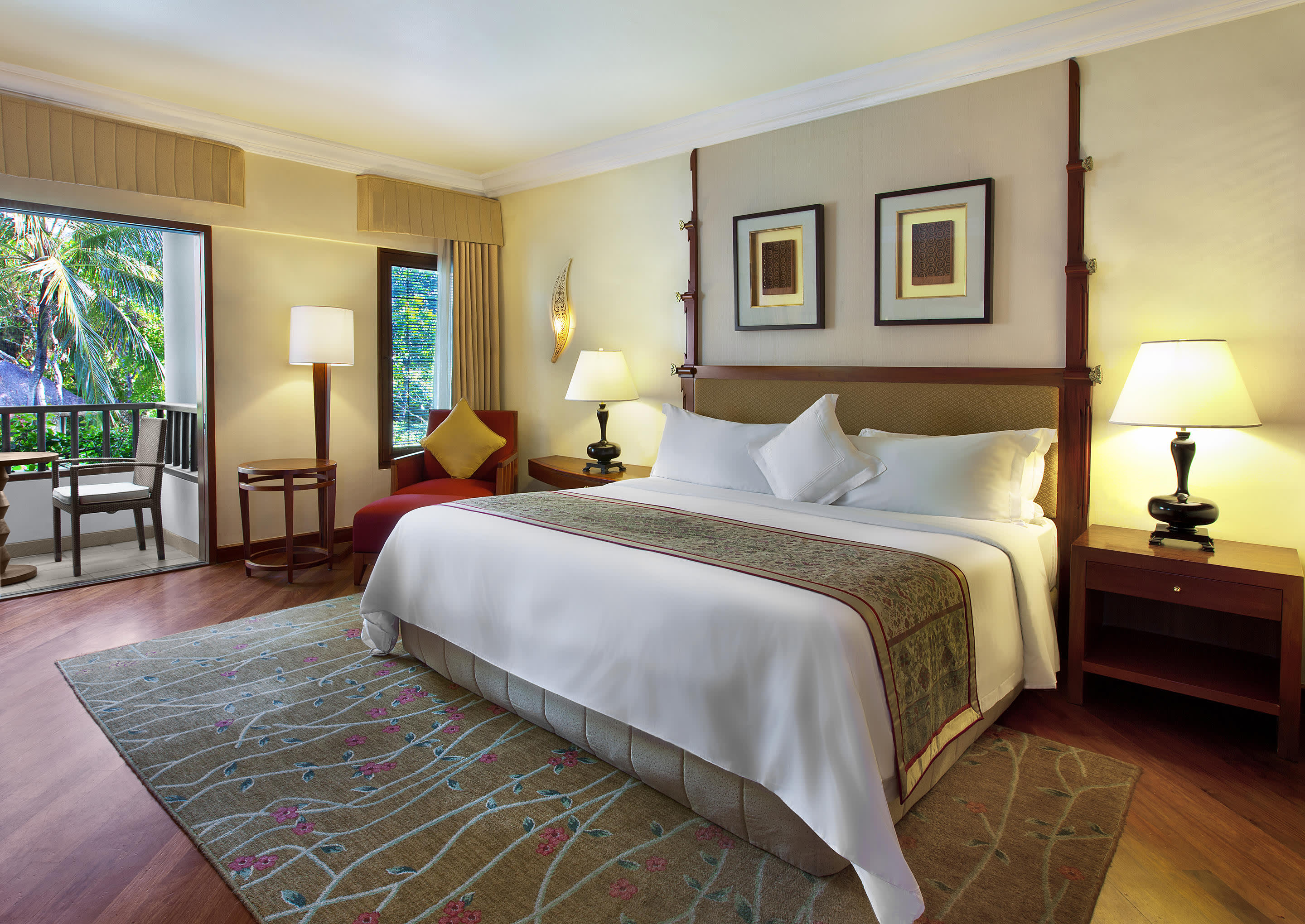 a bedroom with a large bed in a hotel room