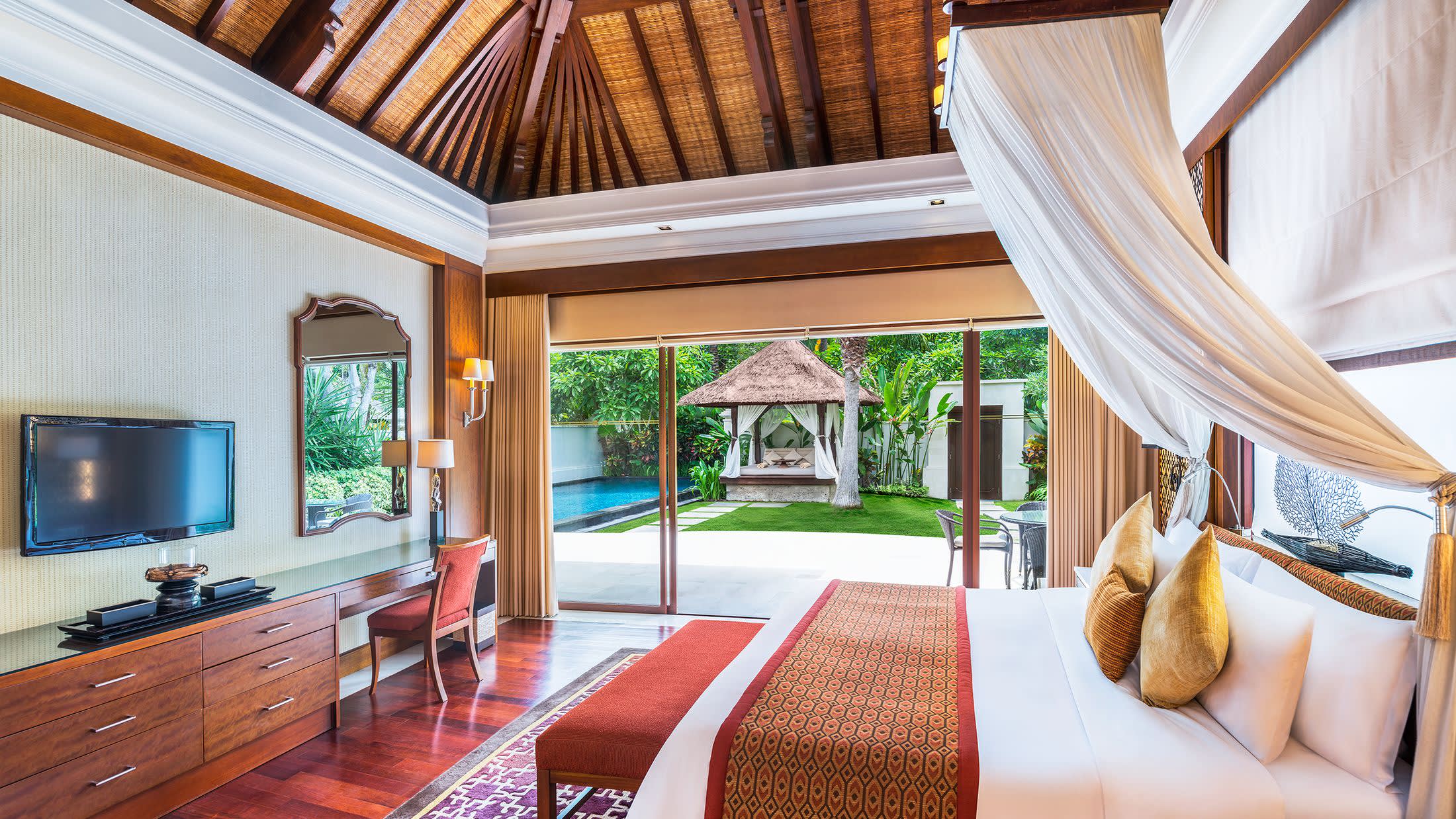 a living room filled with furniture and a large window