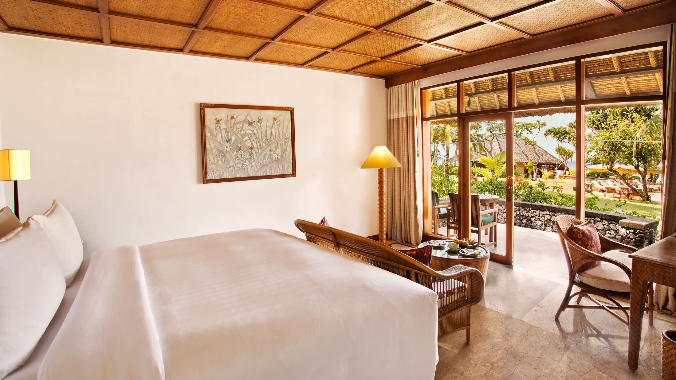 a living room filled with furniture and a large window