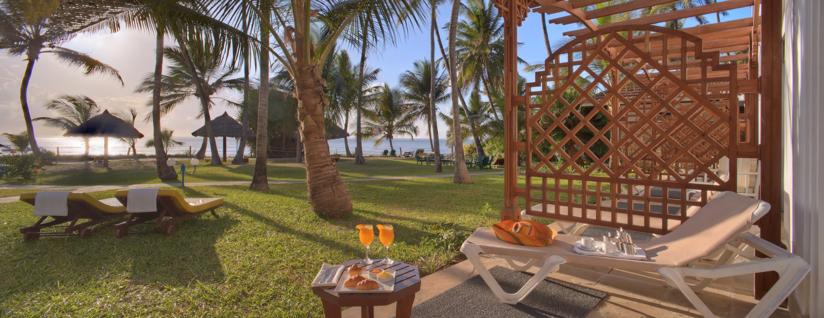 a couple of lawn chairs sitting on top of a picnic table