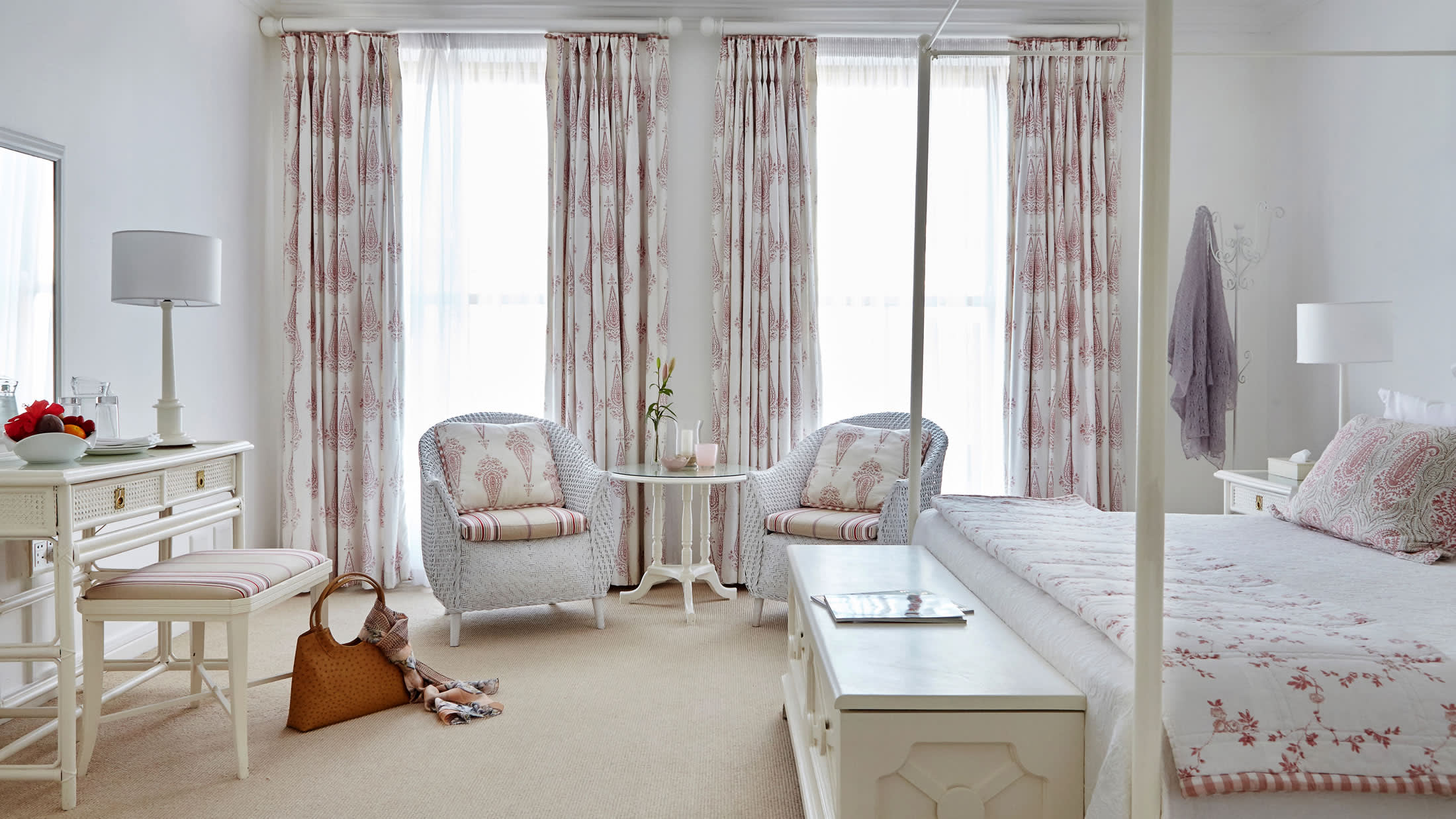 a living room filled with furniture and a bed