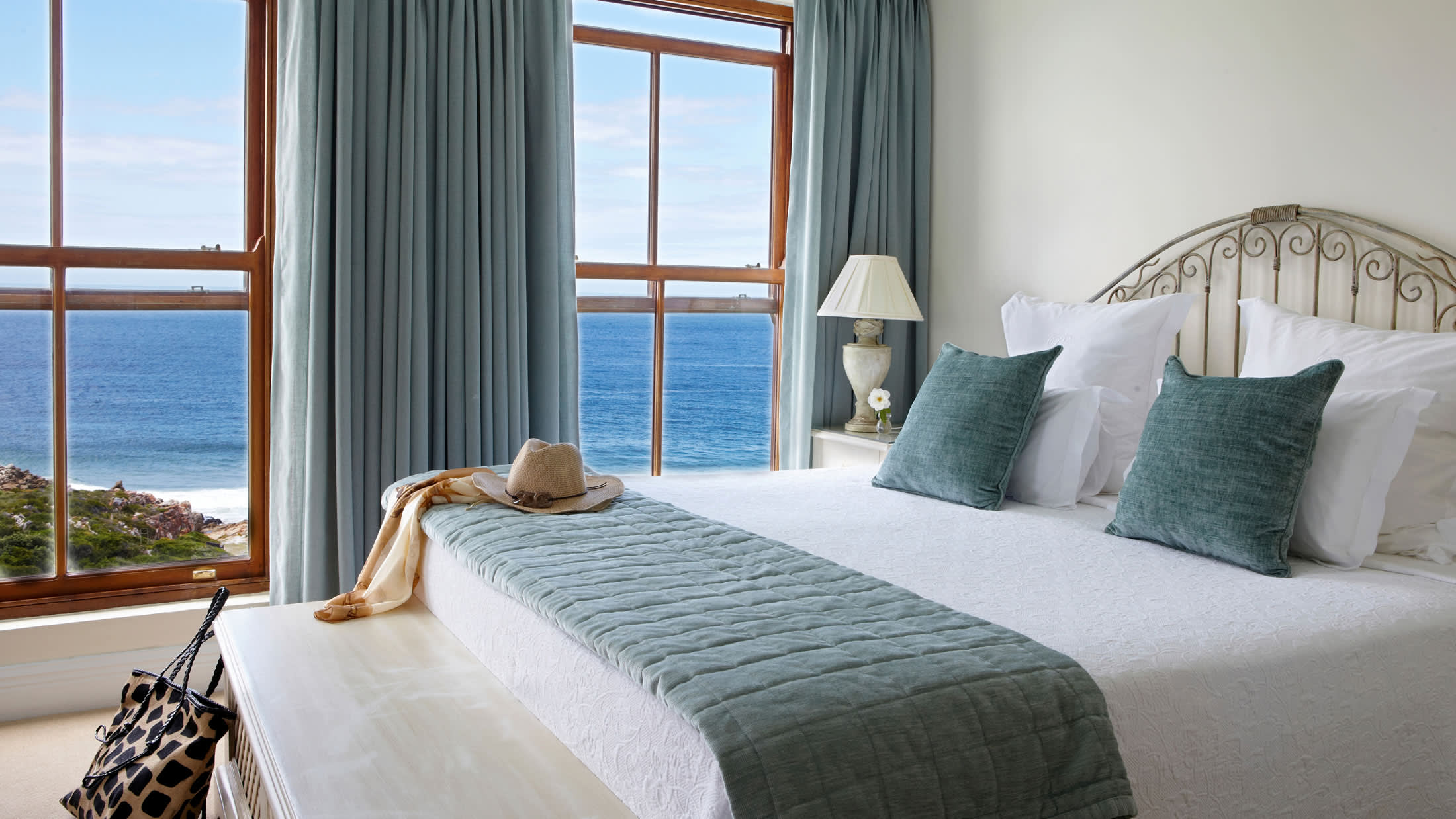 a bedroom with a large bed in a hotel room