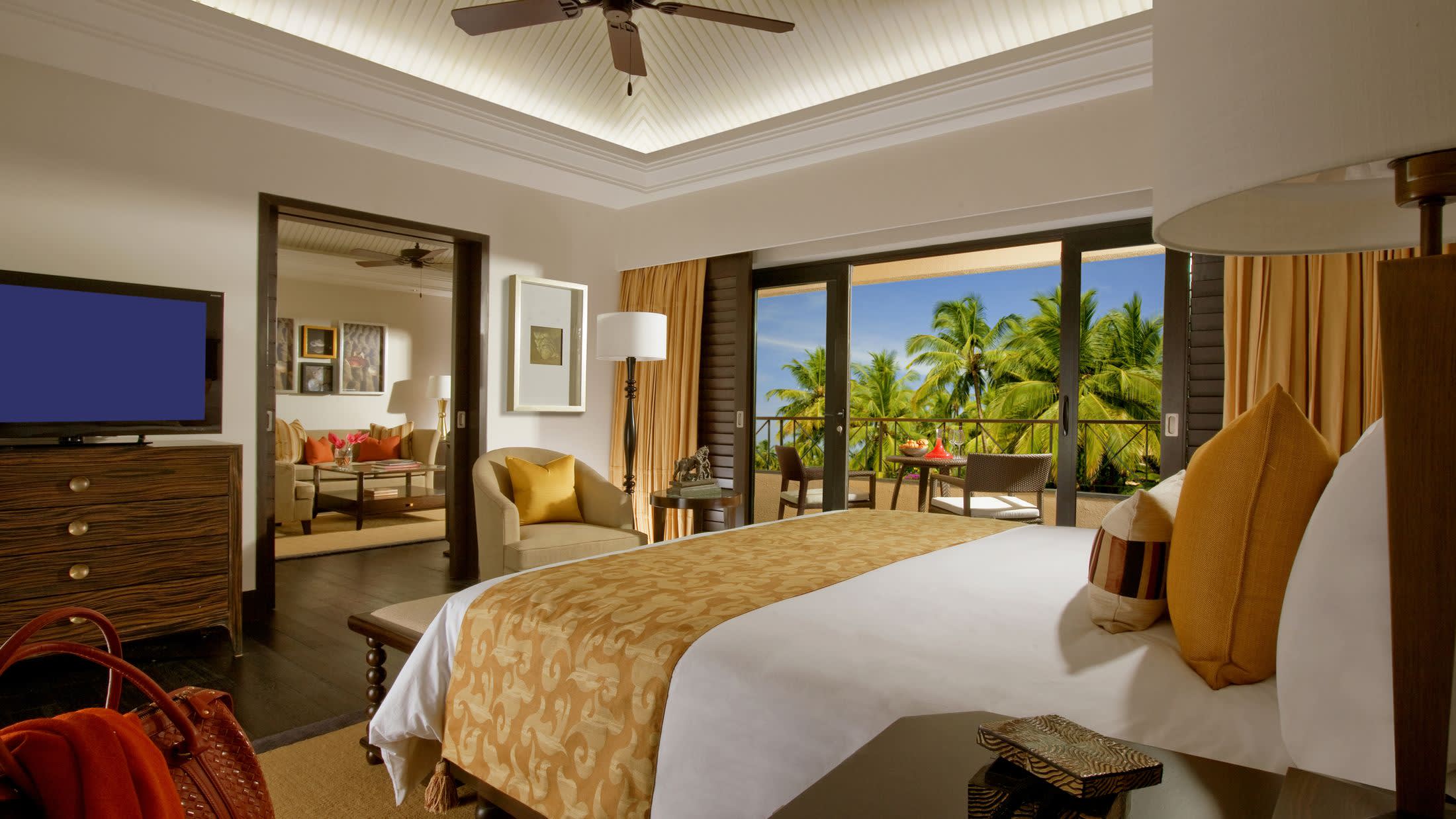 a hotel room filled with furniture and a flat screen tv