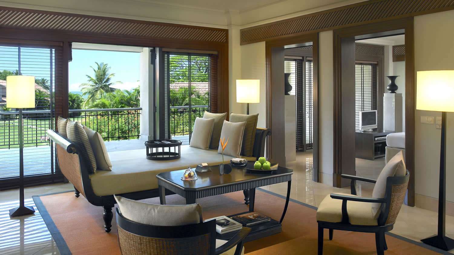 a living room filled with furniture and a large window