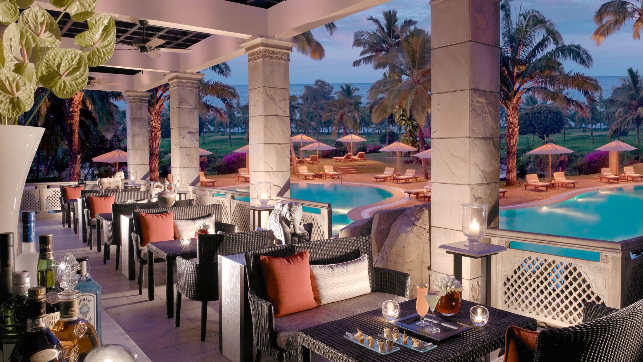 a room filled with furniture and vase on a table