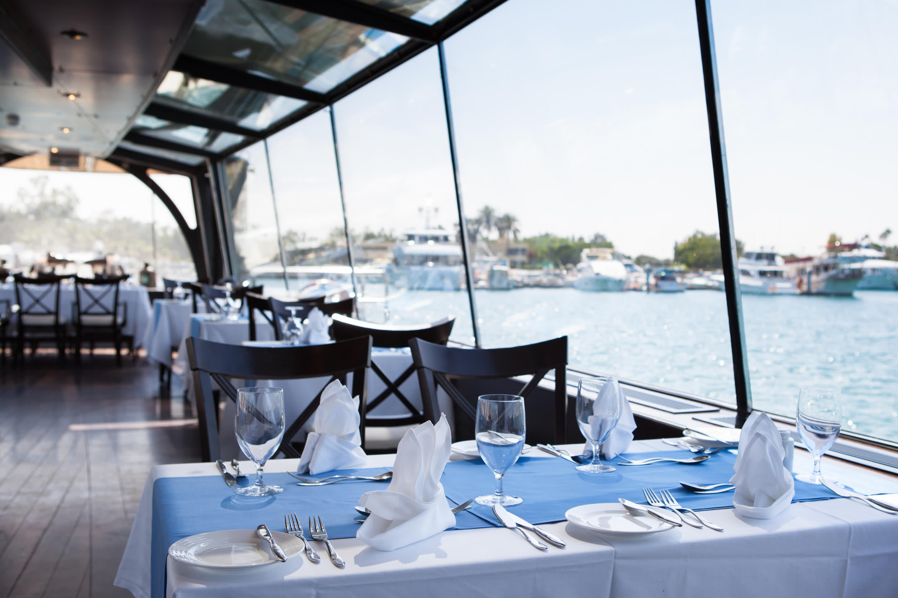 a boat sitting on top of a table next to a body of water