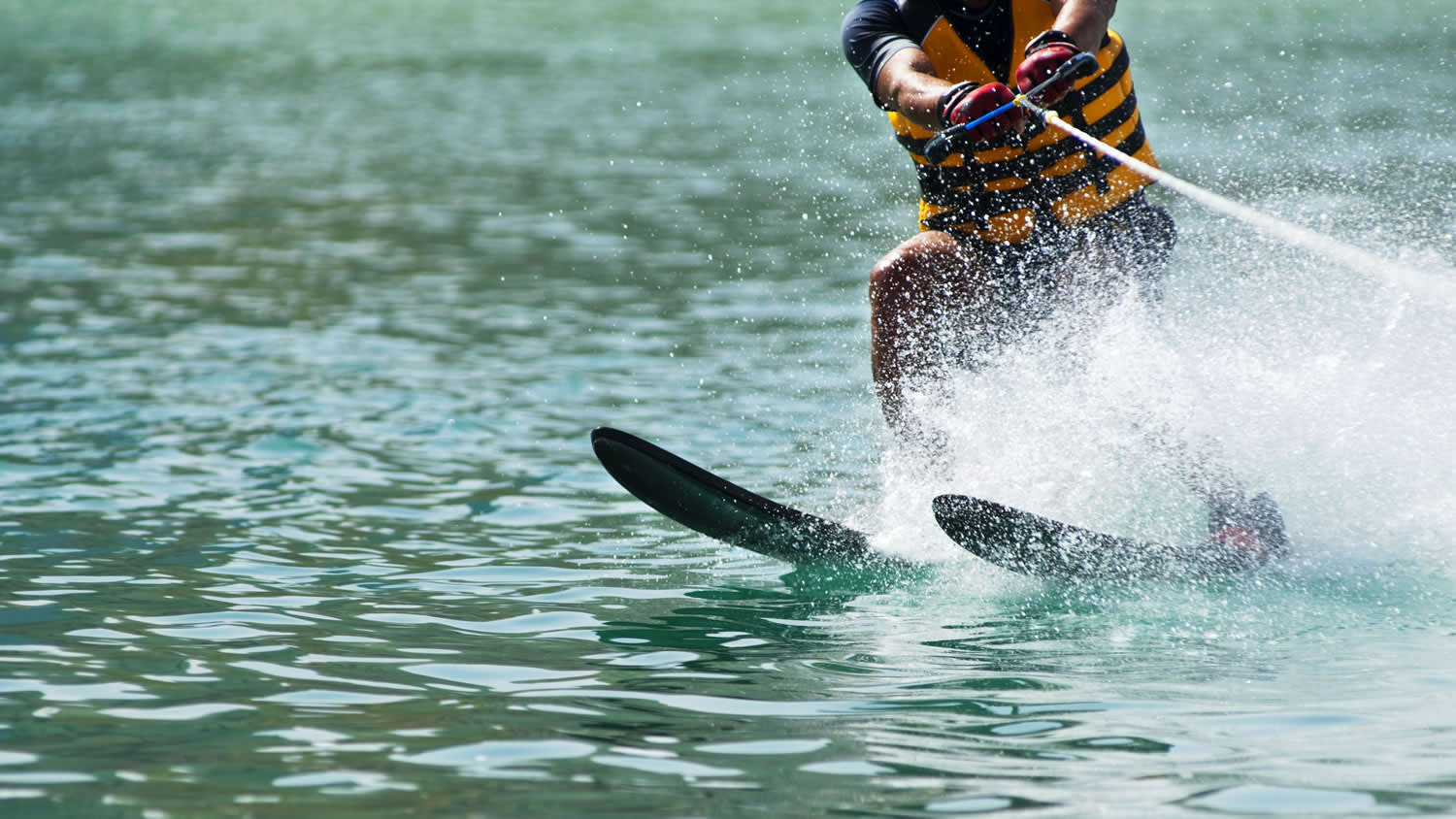 a person riding a surf board on a body of water