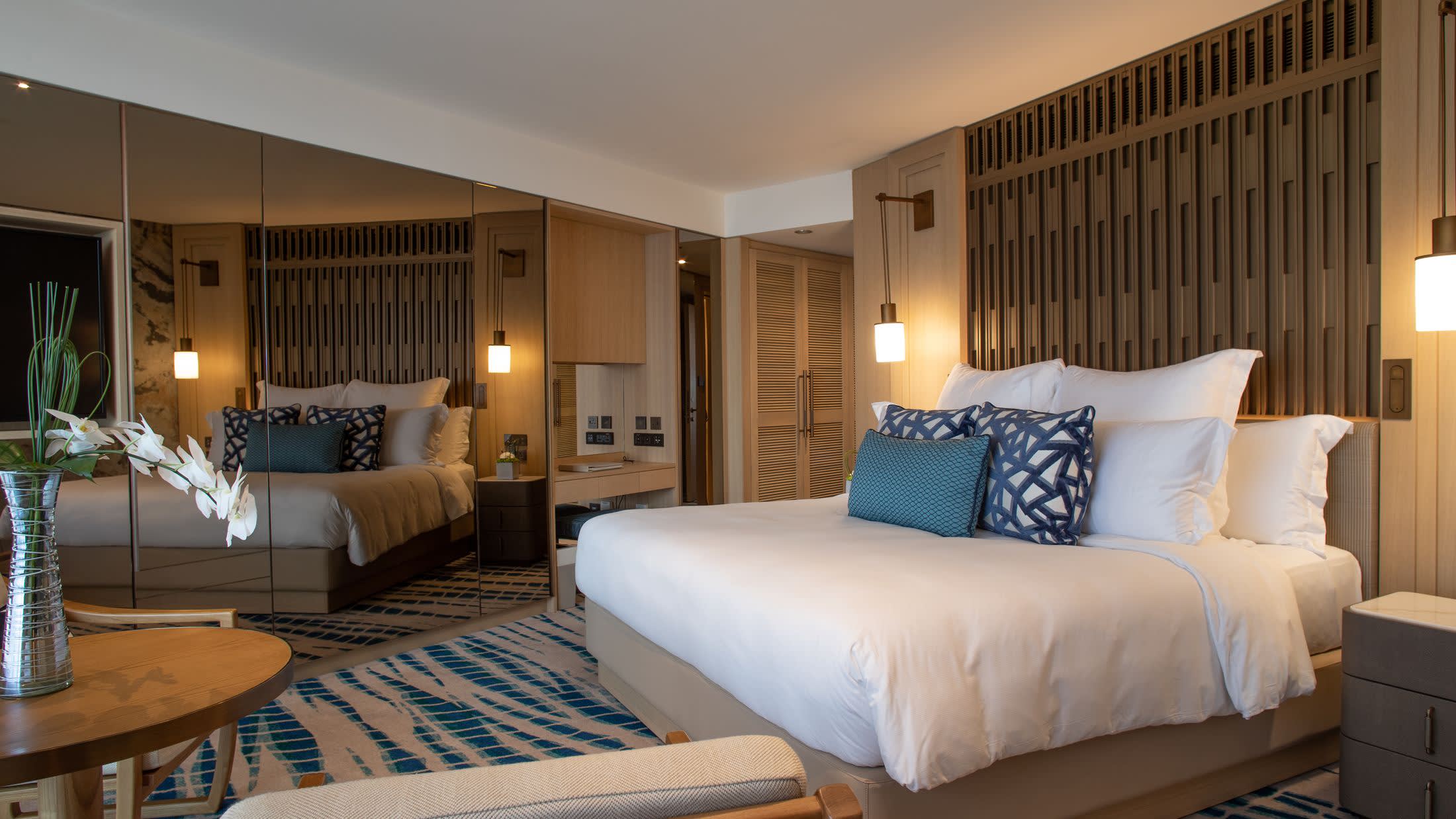 a bedroom with a large bed in a hotel room